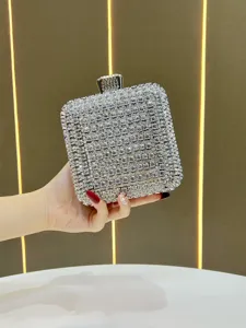 Detailed view of luxury sparkling rhinestone evening clutch bag with shining crystal stones.