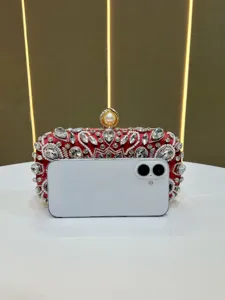 Exquisite red rhinestone evening clutch bag with sparkling crystals and pearl clasp for banquets.