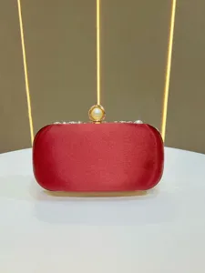Exquisite red satin evening clutch bag with pearl and crystal clasp, elegant party bag.