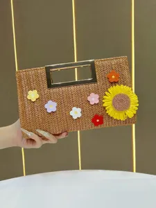 Straw woven clutch bag with metallic top handle and colorful crochet flower decorations chic style.