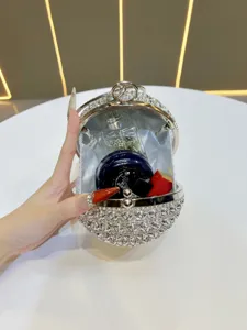 Exquisite rhinestone spherical evening bag with dazzling crystal floral details and spacious interior.