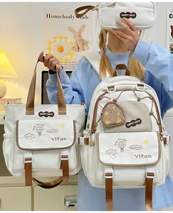 Joli ensemble de cartable blanc pour filles avec sac à dos et tote bag pour usage quotidien.