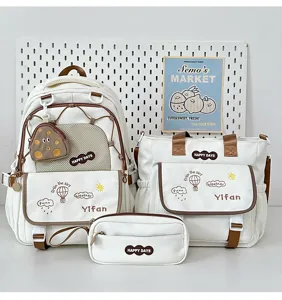 Ensemble de cartable scolaire blanc de trois pièces avec sac et trousse pour filles.