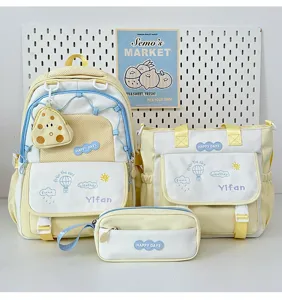 Joli ensemble de sac à dos d'étudiant jaune et blanc, détail de cartable en toile.