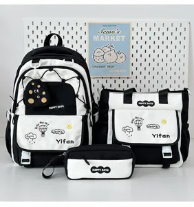 Détail de l'ensemble de sac à dos étudiant noir et blanc avec poches et fermetures.