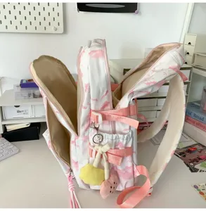 Sac à dos imprimé rose et blanc de grande capacité pour femmes et étudiantes avec plusieurs compartiments.