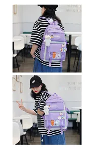 Purple school backpack set for students with cute pendants and badges for daily use