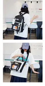 Black and white canvas student backpack with cute plush rabbit pendant and front plaid pocket.