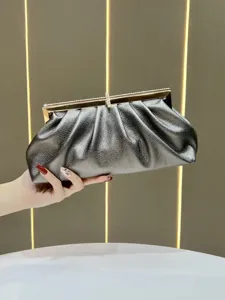Elegant silver clutch bag for women, stylish evening bag with rhinestones and metal frame.