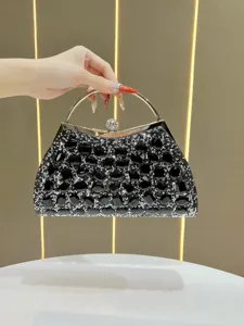 Stunning luxury black rhinestone evening clutch bag with metal ring handle for women.