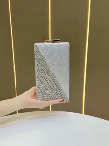 Stunning silver rhinestone evening clutch bag, elegant crystal sparkle design for women parties.