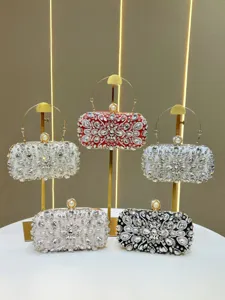 Detailed shot showcasing luxury rhinestone evening clutch bags with sparkly crystals and metal handles.