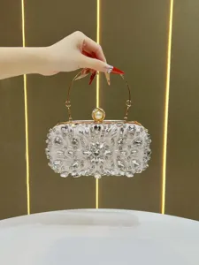 Exquisite rhinestone evening clutch bag with pearl clasp and metal handle for women banquet party.