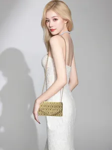 Elegant pearl beaded evening clutch bag with gold chain strap, perfect for party and wedding events.
