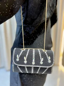 Elegant black rhinestone shoulder bag with metallic chain, perfect evening clutch for women.