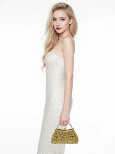 Detailed close-up view of luxury crystal embellished evening clutch bag with metal handle.