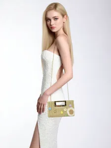 Stylish straw woven crossbody bag with metal handle and cute floral decor for women.