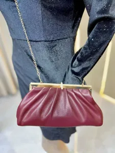 Elegant wine red pleated clutch bag with diamond clasp and chain strap for women evening party.