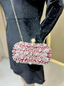 Elegant red rhinestone evening clutch bag with sparkling crystals, pearl clasp and chain strap.