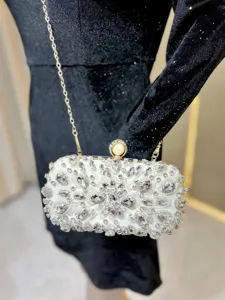 Exquisite rhinestone evening clutch bag with chain strap, sparkling crystal design for parties.