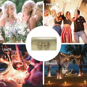 Gold evening clutch bag featuring a sparkly rhinestone bow, perfect for weddings and parties.