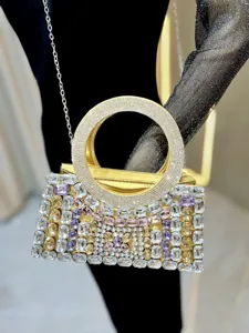 Exquisite rhinestone evening bag detail, sparkling crystal handle and luxurious metallic finish.
