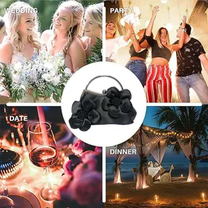 Détail de la pochette de soirée noire en satin à fleurs pour mariage, fête et dîner formel.