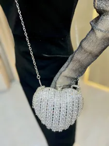 Chic heart-shaped rhinestone evening bag with silver chain strap for party dates.
