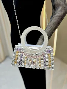 Stunning rhinestone evening bag with circular handle and chain strap for women detail view.
