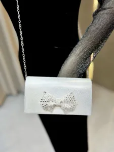 Silver crystal bow evening clutch bag, elegant glitter shoulder bag for party and wedding.