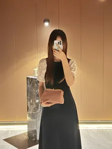 Elegant women's clutch evening bag, stylish kiss-lock design, perfect for party wear.