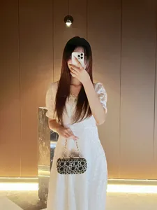 Elegant rhinestone evening clutch bag with chain strap, perfect for weddings and parties.