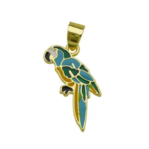 Detailed closeup of a colorful enamel parrot pendant, gold-plated metal fashion jewelry accessory.