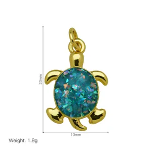 Golden turtle pendant with blue glitter inlay, compact size 23x13mm, elegant fashion jewelry accessory.