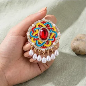 Broche vintage de nudo chino con gota de aceite colorida gema perla borla vista de detalle