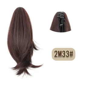 Detailed view of short brown synthetic hair claw clip ponytail showing inner fixing mechanism