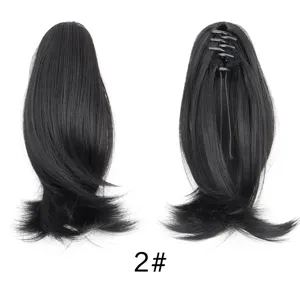 Synthetic hair claw clip ponytail extension detail view, short wavy black hair piece.