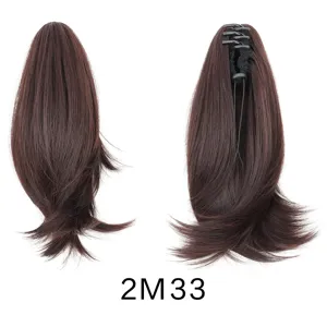 Detailed view of dark brown short wavy claw clip ponytail wig showing inner clip and hair texture.