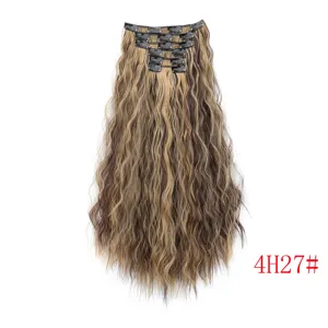 Detail view of long curly clip-in hair extensions with highlights and secure clips.