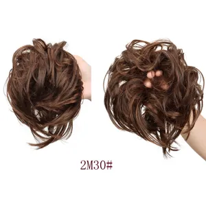 Synthetic messy hair bun detail view showing the fluffy curly texture and elastic band design.