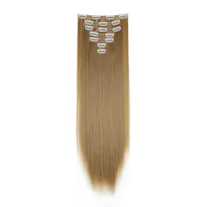 Golden blonde synthetic long straight clip in hair extensions detail view with metal clips