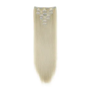 Close up of light blonde straight synthetic hair extensions showing metal clips detail