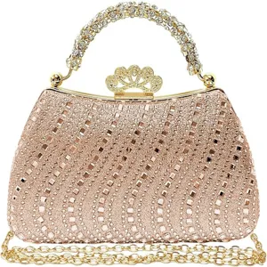 Detailed view of the sparkling rhinestone evening clutch bag in rose gold with crown design.
