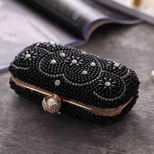 Black beaded rhinestone evening clutch bag with gold frame and pearl clasp detail.