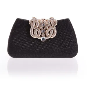 Black glitter clutch bag with luxurious rhinestone encrusted gold clasp detail for evening events.