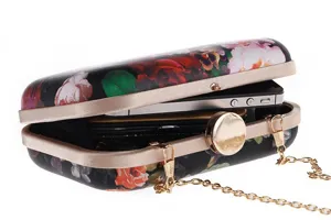 Floral print hard clutch bag detail, elegant evening party purse with metal chain and secure clasp.