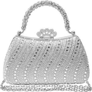 Detailed view of the sparkling rhinestone evening clutch bag with elegant crown clasp and crystal handle.