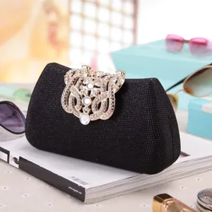 Elegant black glitter evening clutch bag with sparkling rhinestone metal clasp for parties.