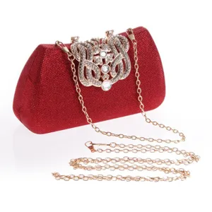 Red glitter evening clutch bag with rhinestone crown clasp and metal chain strap for women party.