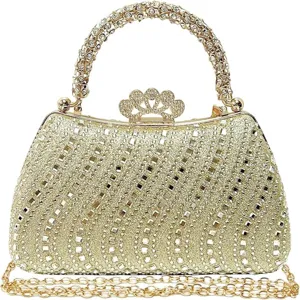 Close-up detail of the glittering gold rhinestone evening bag clasp and sparkly crystal handle.